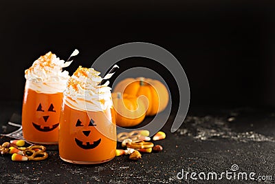 Halloween cold cocktail or drink with jack o`lantern face Stock Photo