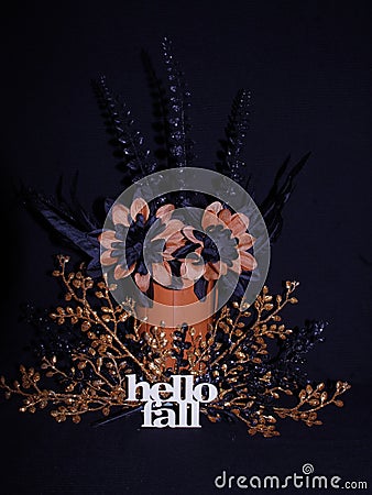 Halloween colors black and oranged flowers and sparkly orange and black leaves, hello Fall Stock Photo