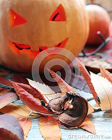 Halloween composition of jack o` lantern, pumpkins, illumination, mystical decor Stock Photo