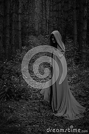 Halloween concept. A witch in a black robe Stock Photo