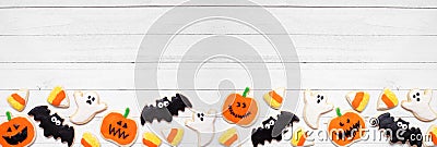 Halloween cookie bottom border on a white wood banner background Stock Photo