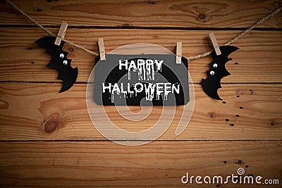 Halloween crafts, bat, spider and cobweb on wooden table background with Happy Halloween text. halloween concept. and cobweb on w Stock Photo