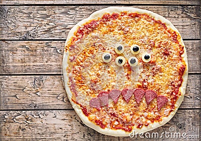 Halloween creative scary food monster zombie face pizza snack with mozzarella Stock Photo