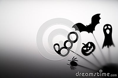 Halloween Decoration. Terrifying Shadow Puppets. Shadows pumpkin, bat, ghost, spider, and Boo word on the gray Stock Photo