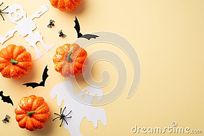 Halloween decorations concept. Top view photo of pumpkins spiders ghost skeleton and bats silhouettes on isolated beige background Stock Photo