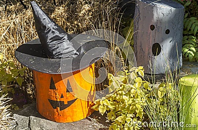 Halloween decorations Witch hat on a log Stock Photo