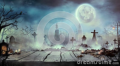 Halloween design with wooden table and graveyard Stock Photo