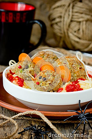 Halloween dinner idea for kids baked bloody rats in potatoes wit Stock Photo