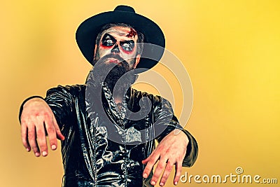 Halloween. Evil vampire man. Bearded man dressed like Halloween monster. Halloween man with pumpkin. Devil man with Stock Photo