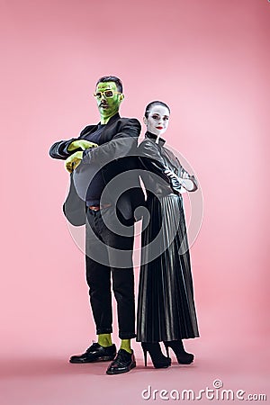 Halloween Family. Happy couple in Halloween Costume and Makeup Stock Photo