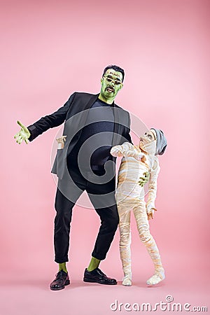 Halloween Family. Happy Father and Children Girl in Halloween Costume and Makeup Stock Photo