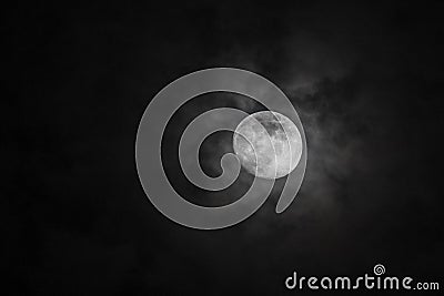 Halloween full moon in pitch black dark skies with clouds Stock Photo