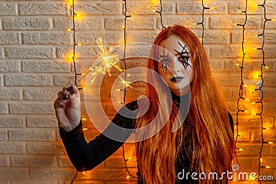 Halloween Witch, garland on background. Stock Photo