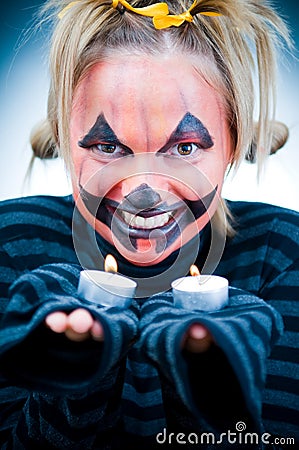 Halloween girl with candles Stock Photo