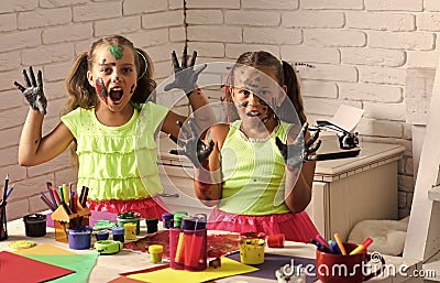 Halloween girls with scary faces colored with paints Stock Photo