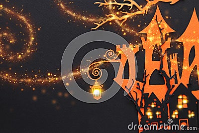 Halloween holiday concept. haunted witch house over black background. Top view, flat lay. Stock Photo