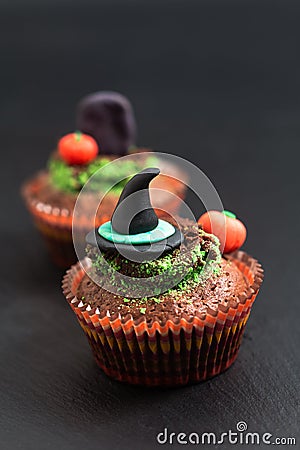 Halloween Holiday food colorful fancy brownies cupcake with witch and pumpkin fondant decorate Stock Photo