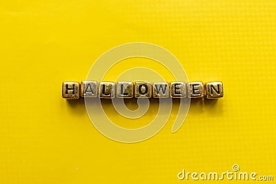 Halloween inscription on the cubes. Halloween title with yellow background Stock Photo