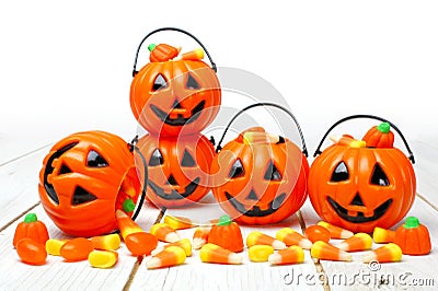 Halloween Jack o Lantern candy holders on white wood Stock Photo