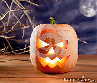 Halloween lantern pumpkin in dark sky clouds Stock Photo