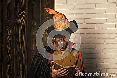 Halloween man in witch hat and cloak Stock Photo