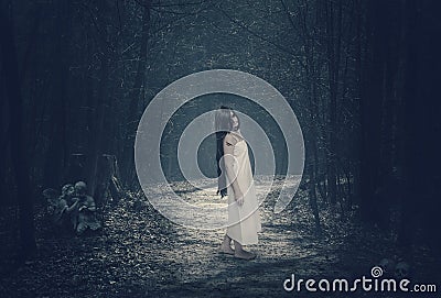 Halloween mystical forest with ghost Stock Photo