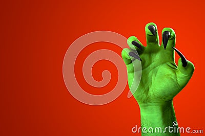 Halloween, nightmare creature and evil monster horror story concept with a scary zombie or demon hand with creepy long black nails Stock Photo