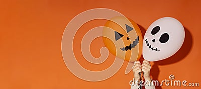 Halloween orange background with creative ghost and pumpkin Stock Photo