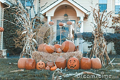 Halloween outdoor pumpkin decorations in front of house yard Stock Photo