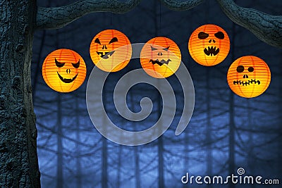 Halloween paper lanterns in a dark and spooky forest Stock Photo