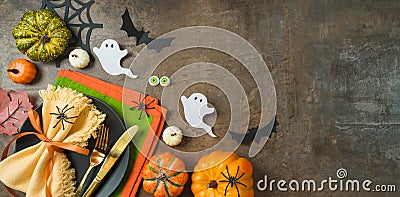 Halloween party banner concept with plate, pumpkin and decorations on dark background. Top view, flat lay Cartoon Illustration