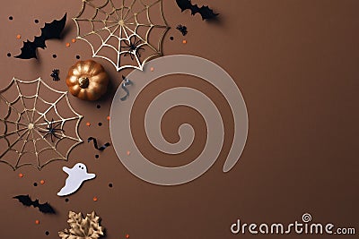 Halloween party decorations from pumpkins, bats, spider web and ghosts top view. Happy halloween holiday greeting card Stock Photo