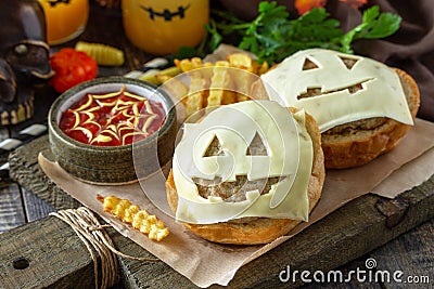 Halloween party food. Halloween party fun ghost burger, ketup sauce and potatoes frie. Stock Photo