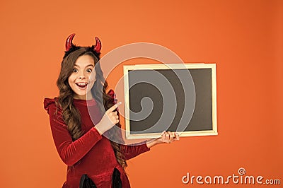 Halloween party. Remember the ghoul times. Little girl cute horns Halloween advertisement. Child imp hold blackboard Stock Photo