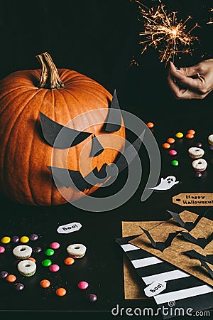 Halloween preparation. Hands making halloween cards using craft paper Stock Photo
