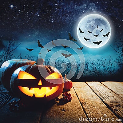Halloween Pumpkin in a dark mist Forest. Elements of this image furnished by NASA Stock Photo