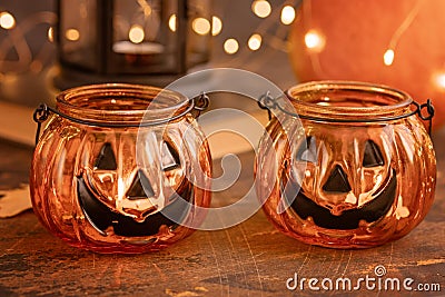 Halloween pumpkin head jack glass lantern. Halloween decoration on wooden table background, selective focus Stock Photo