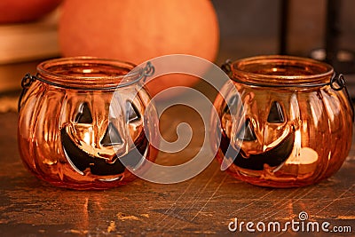 Halloween pumpkin head jack glass lantern. Halloween decoration on wooden table background, selective focus Stock Photo