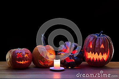Halloween pumpkin head jack lantern with scary evil faces and candles Stock Photo