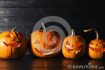 Halloween pumpkin head jack lanterns on table Stock Photo