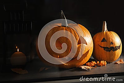 Halloween pumpkin heads. Jack lanterns on windowsill Stock Photo