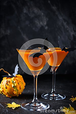 Halloween pumpkin orange cocktails. Festive drink. Halloween party. Funny Pumpkin with holiday decorations Stock Photo