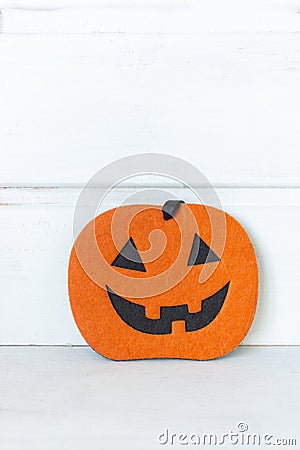 Halloween pumpkin on white background with copy space. Halloween decoration. Traditional October still life. Scary pumpkin. Stock Photo