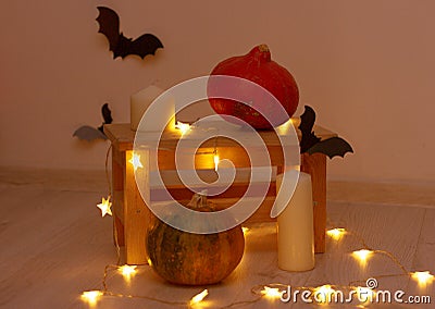 Halloween pumpkins, bats, candles and the lanterns Stock Photo