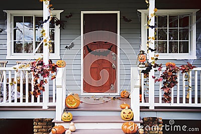 Halloween pumpkins and decorations outside a house Stock Photo