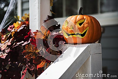 Halloween pumpkins and decorations outside a house Stock Photo