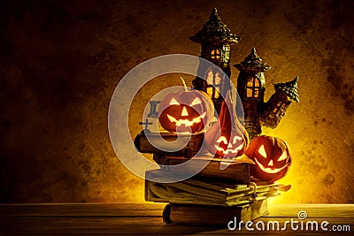 Halloween pumpkins of night spooky and Castle on wooden Stock Photo