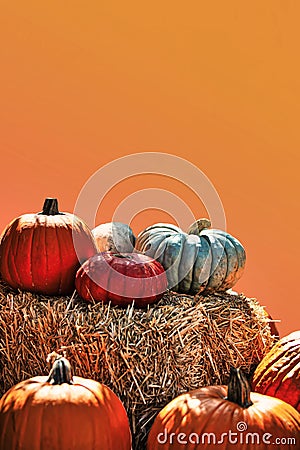 halloween pumpkins stacked on haystack Stock Photo