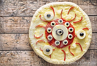 Halloween scary food funny eye monster pizza horror snack with mozzarella Stock Photo