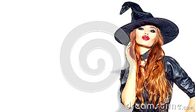 Halloween Sexy Girl wearing witch costume with a hat. Party, Celebrating. Beauty Woman with long hair and holiday bright makeup Stock Photo